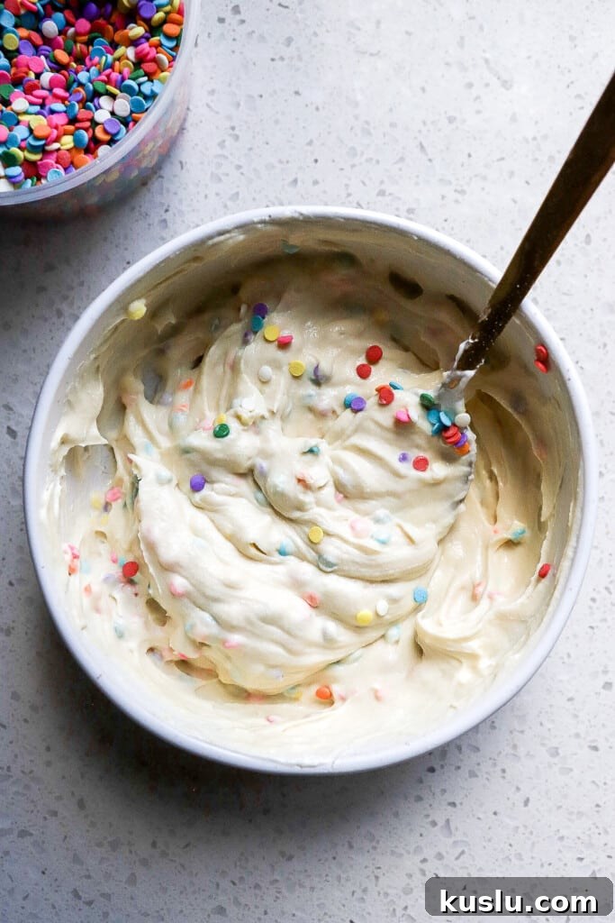 High-Protein Dunkaroo Dip: 5-Minute Party Snack 5 Top down view of high protein dunkaroo dip in small white bowl.