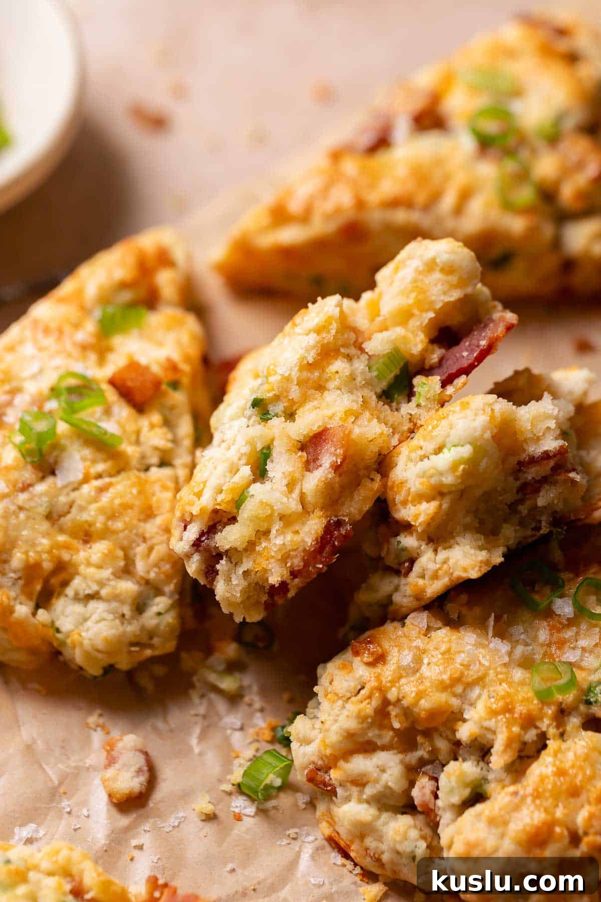 Bacon, Cheddar & Scallion Scones: Savory Breakfast Biscuits 10 Bacon cheddar scones broken in half to show the soft and tender texture.