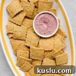 Close up of crackers on a platter with dip.