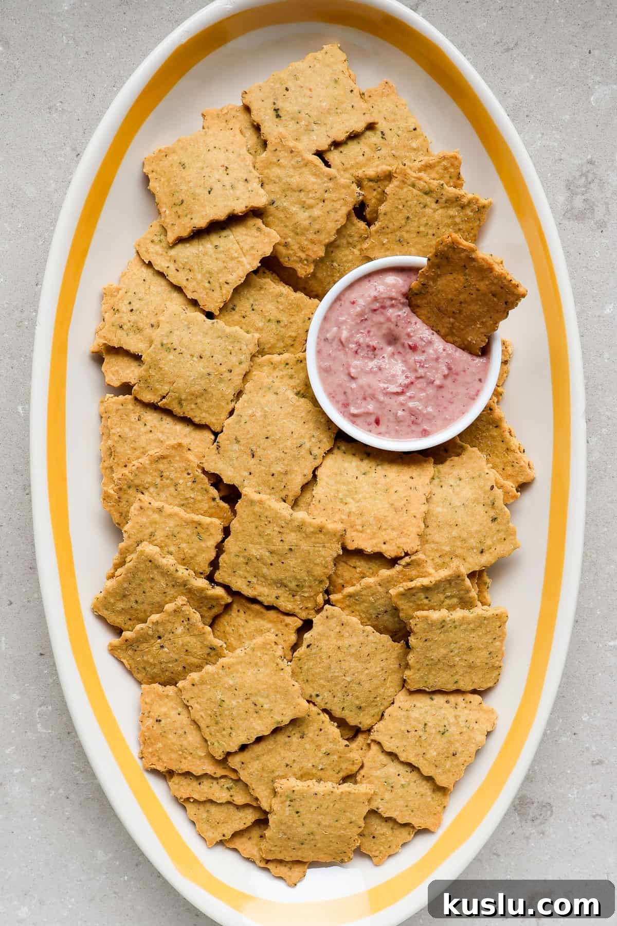 Crackers on a platter with dip.