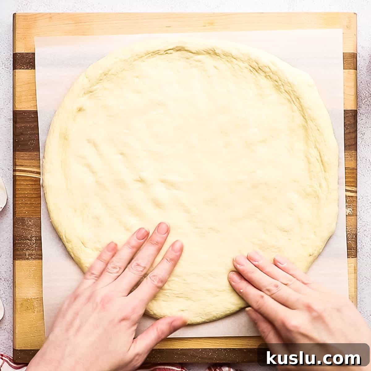 How to Make Thick Crust Pizza at Home: Crispy Edge, Chewy Center 12 spreading the pizza dough with fingertips