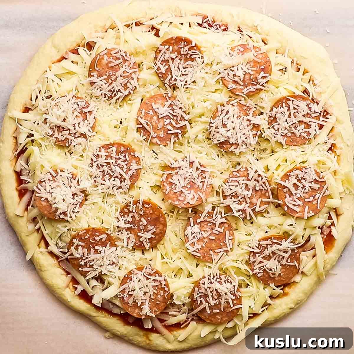 How to Make Thick Crust Pizza at Home: Crispy Edge, Chewy Center 17 pizza ready to go into the oven to bake