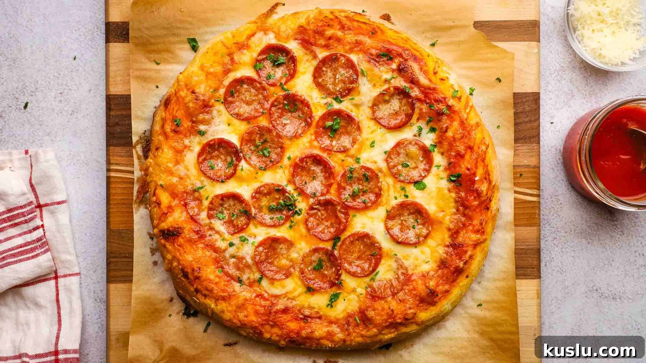 How to Make Thick Crust Pizza at Home: Crispy Edge, Chewy Center 4 overhead view of homemade thick crust pizza on a wooden board