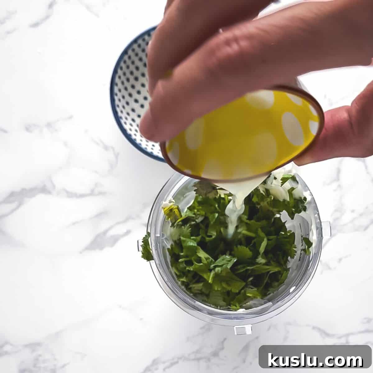 Cilantro Lime Crema: Creamy Sauce Recipe for Tacos & Bowls 5 Lime juice poured into a blender cup.