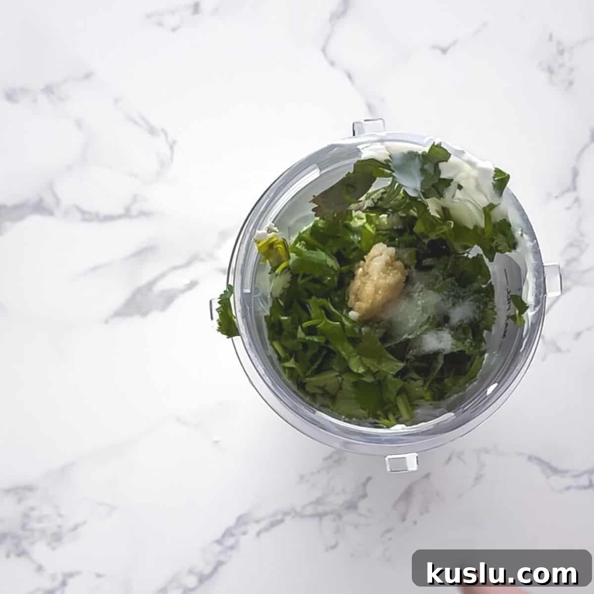 Cilantro Lime Crema: Creamy Sauce Recipe for Tacos & Bowls 6 Ingredients in a blender cup.
