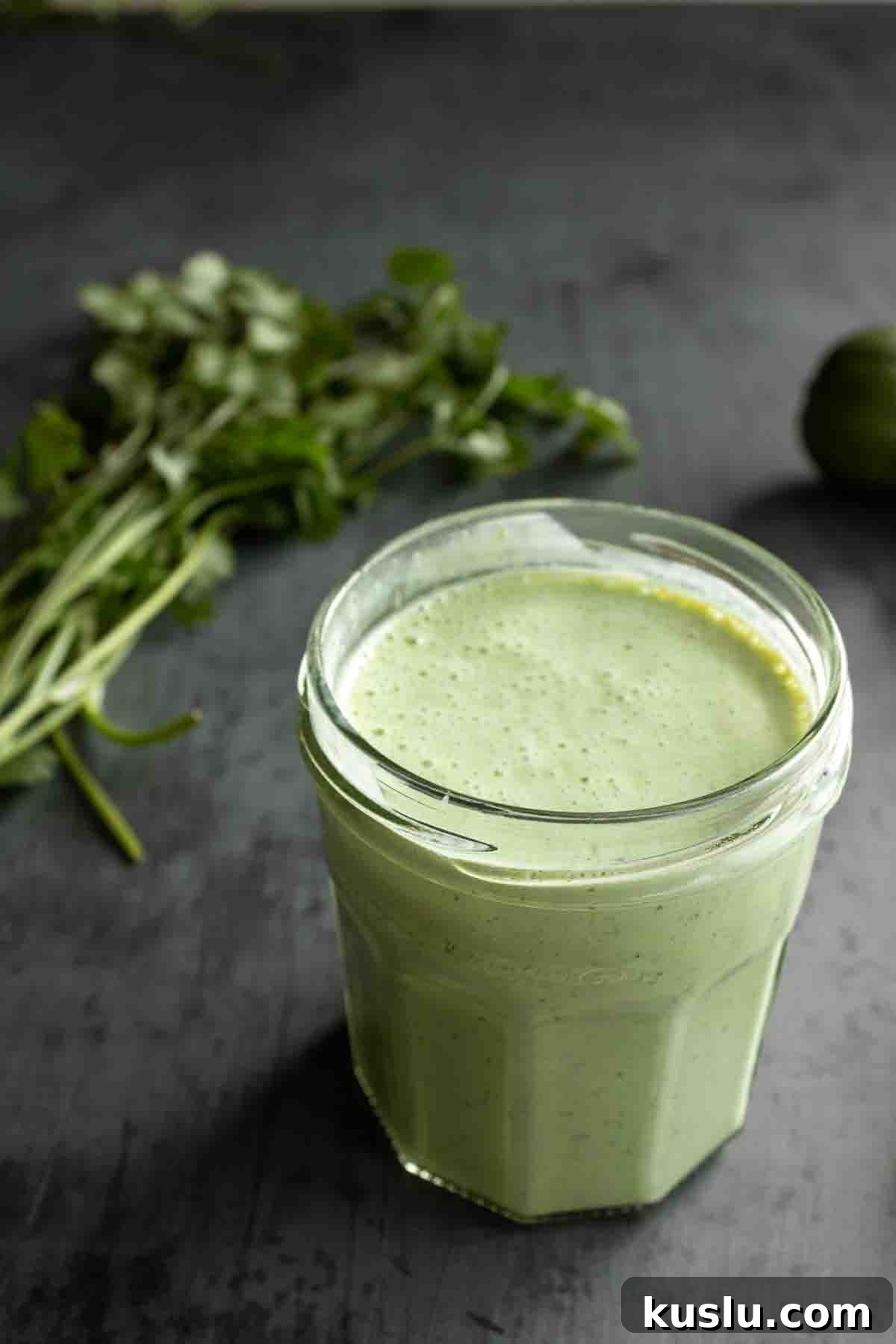 Cilantro Lime Crema: Creamy Sauce Recipe for Tacos & Bowls 9 Cilantro lime dressing in a jar.