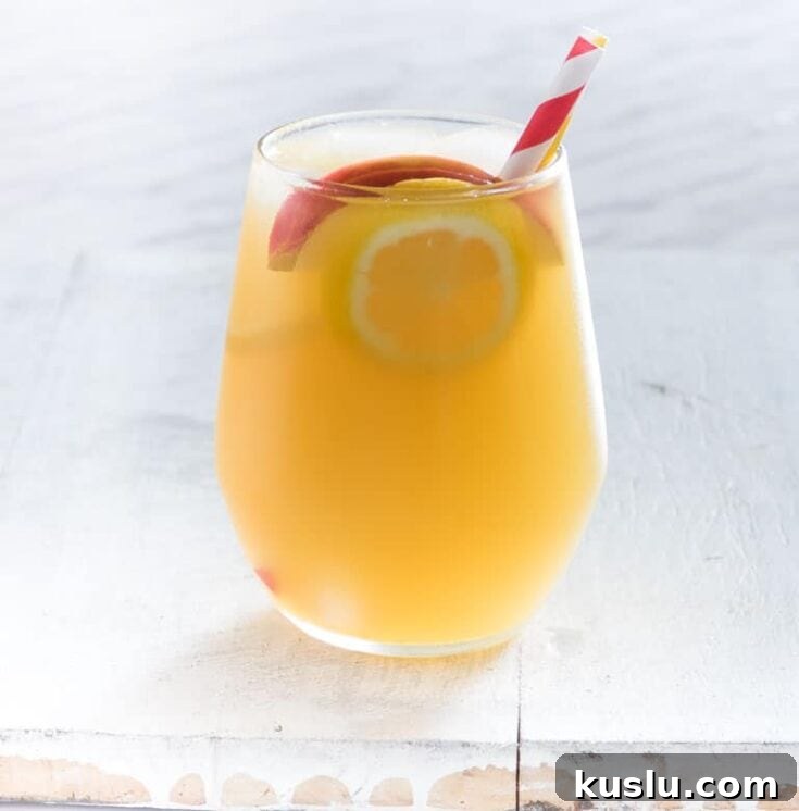 A gin apple pie cocktail on a white background.