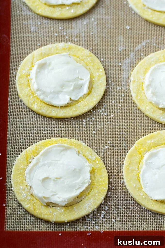 Puff pastry rounds topped with a sweet cream cheese filling.