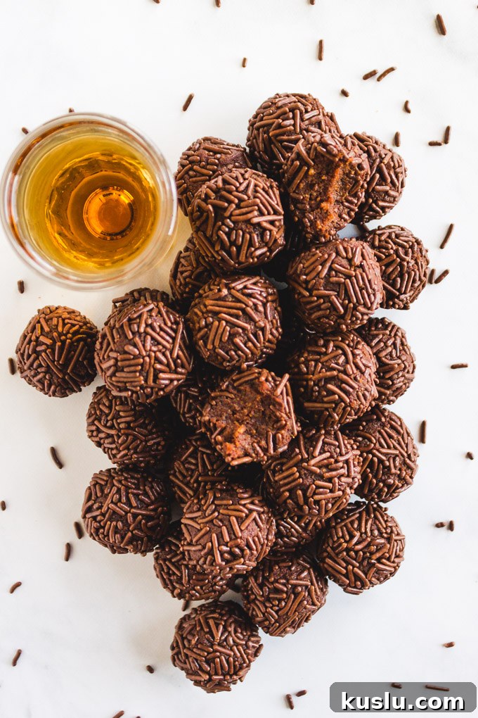 Date Sweetened Rum Balls - Soft, chocolate-y, boozy balls coated in chocolate sprinkles.