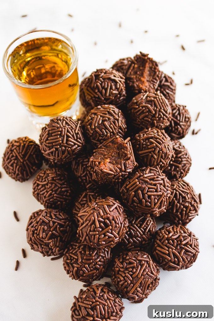 Date Sweetened Rum Balls - Soft, chocolate-y, boozy balls coated in chocolate sprinkles.