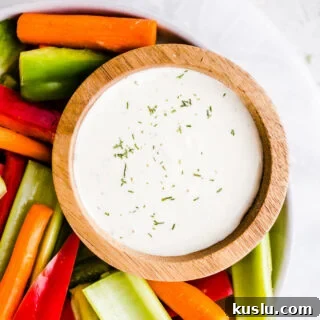 Ranch dressing in a bowl with vegetables