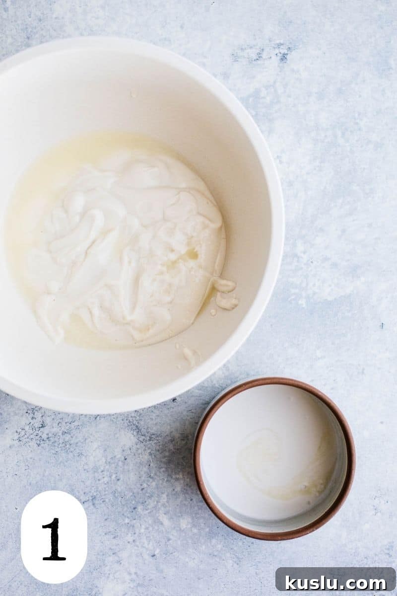 Two bowls with yogurt and coconut milk.