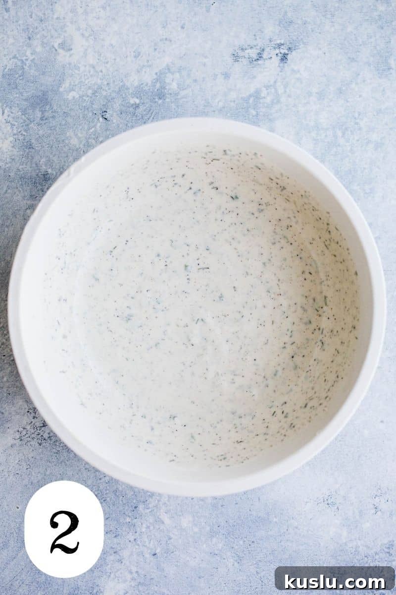 Freshly made ranch dressing in a mixing bowl. 