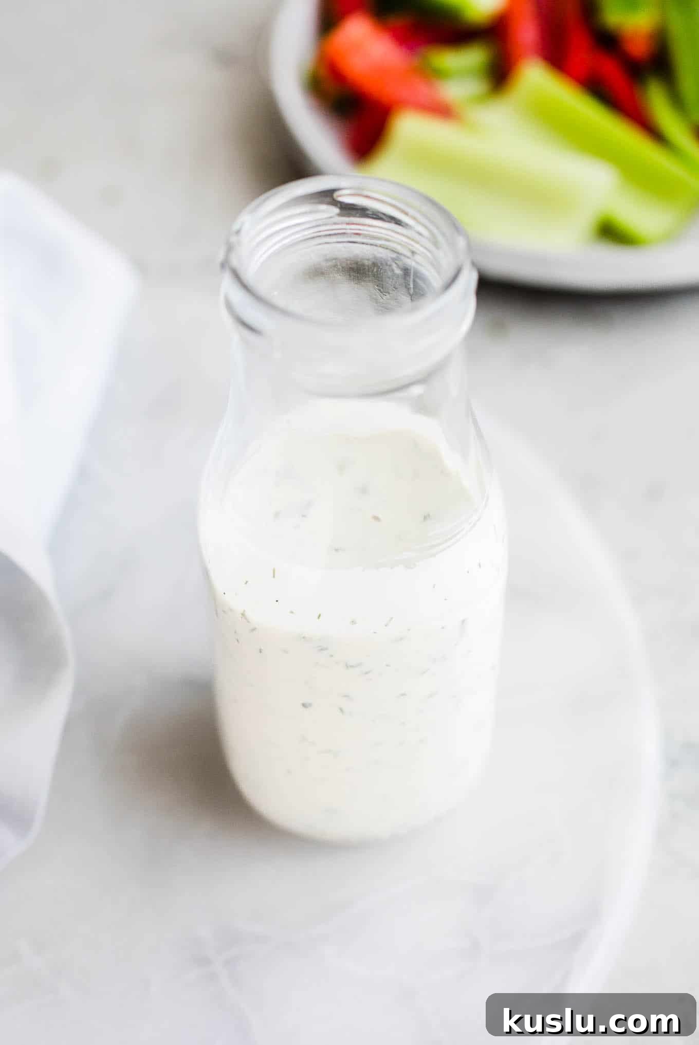 Salad dressing in a glass bottle. 