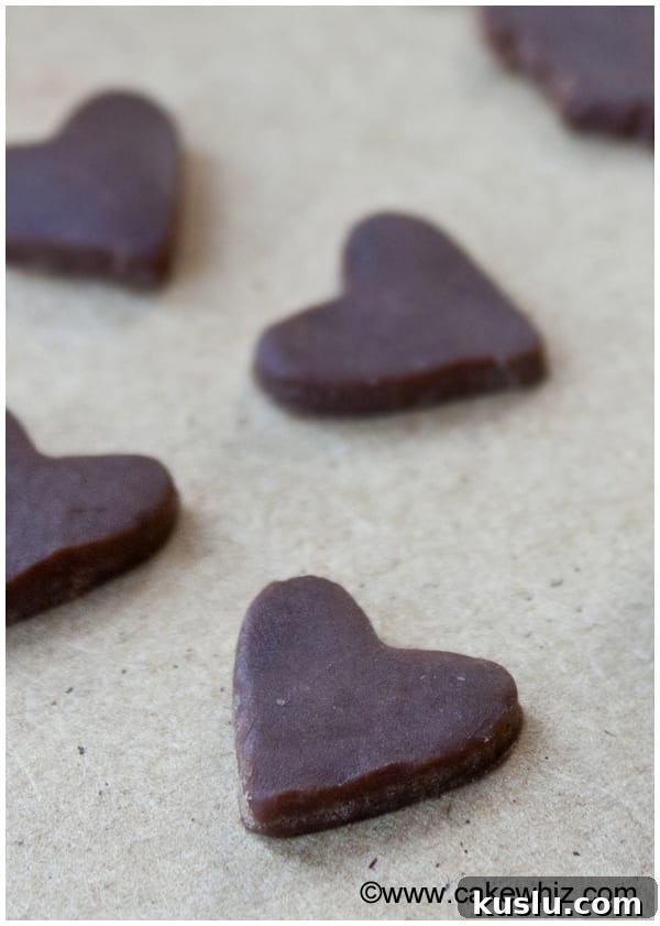 Make Modeling Chocolate (Candy Clay): Step-by-Step Recipe 3 Homemade Candy Clay Hearts on Wood Background