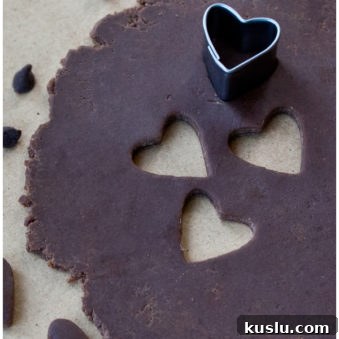 Make Modeling Chocolate (Candy Clay): Step-by-Step Recipe 6 Easy Modeling Chocolate or Candy Clay Rolled Out on Table With Heart Cut Outs