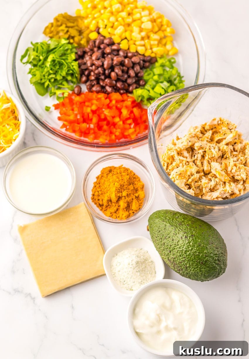 Southwestern Egg Rolls Copycat Recipe — Chili’s-Style Appetizer 4 an overhead image showing the measured ingredients needed to make a batch of copycat chili's southwestern egg rolls
