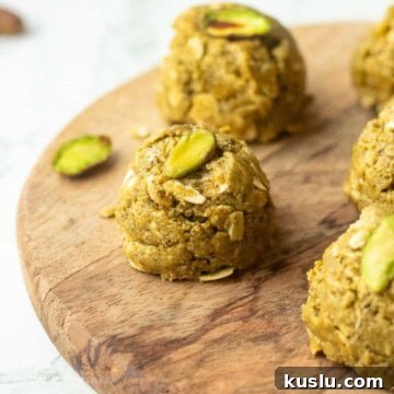 Pistachio Energy Protein Balls for Quick Snacks 12 Pistachio protein ball on wooden board.