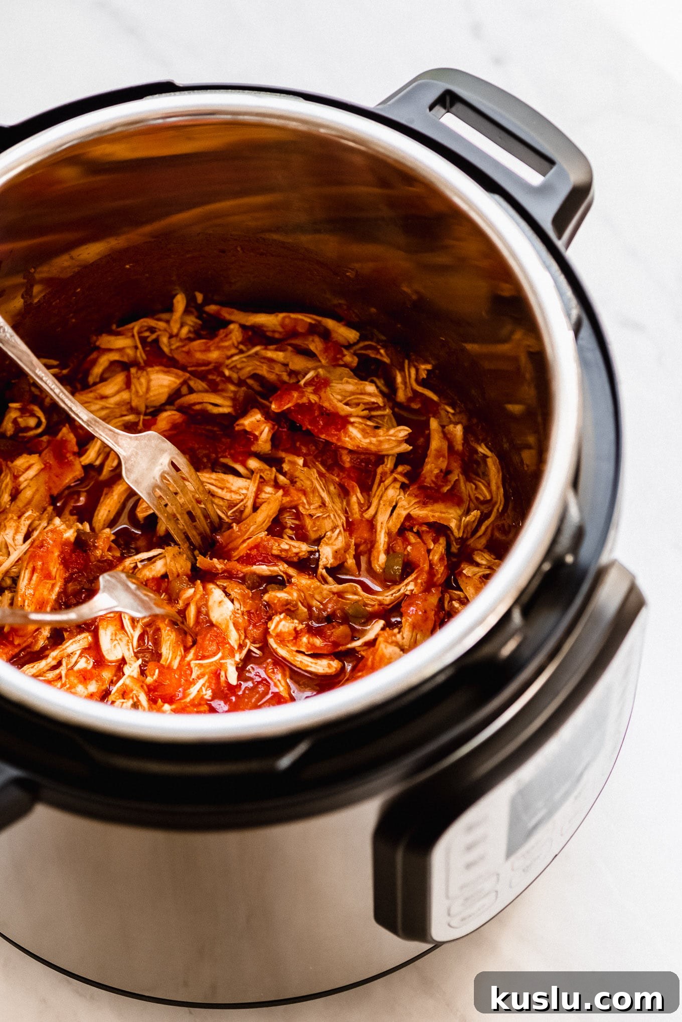 Shredded Salsa Chicken Shredded Instant Pot Salsa Chicken in the pressure cooker.