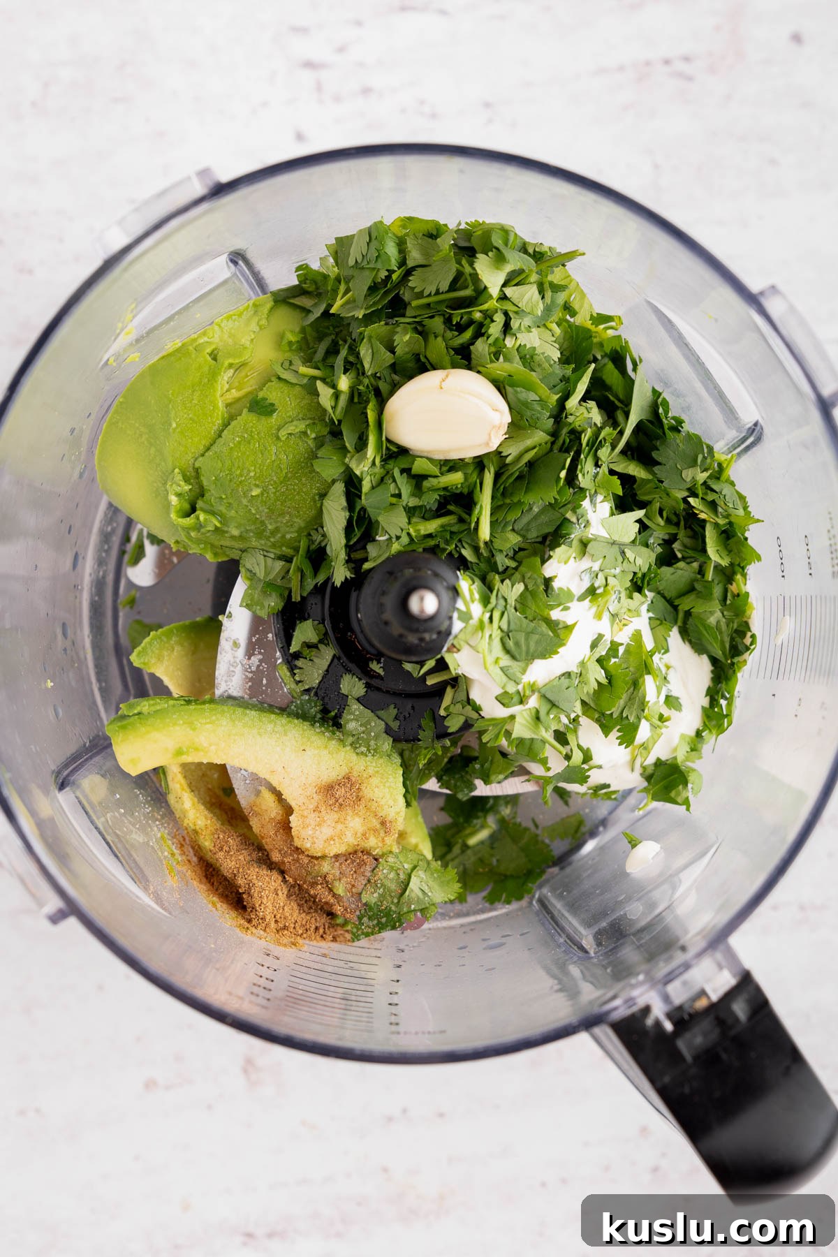 Grilled Steak Salad with Avocado-Lime Cilantro Crema 7 All of the ingredients for the avocado-lime crema in the food processor bowl before blending.