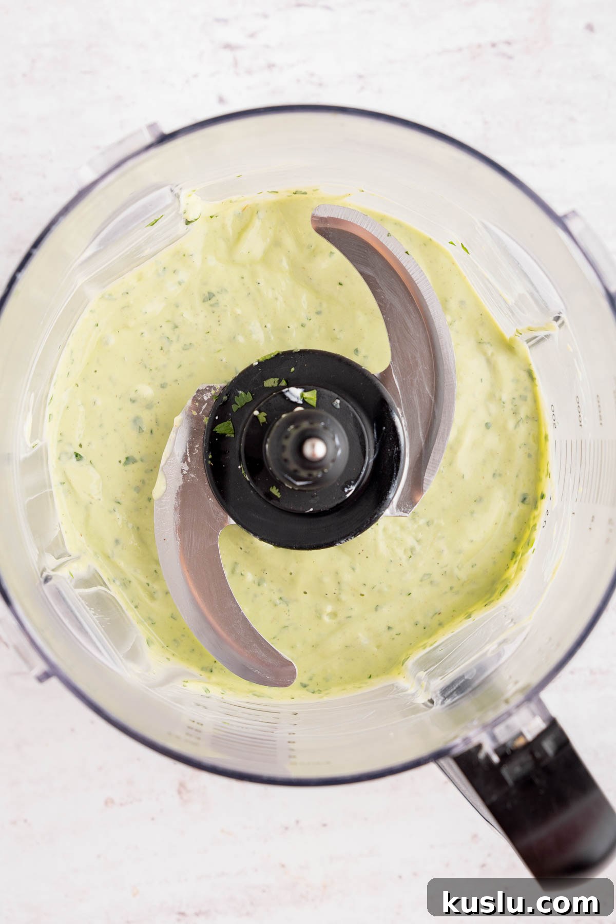 Grilled Steak Salad with Avocado-Lime Cilantro Crema 8 The avocado-lime cilantro crema in the food processor bowl after blending.