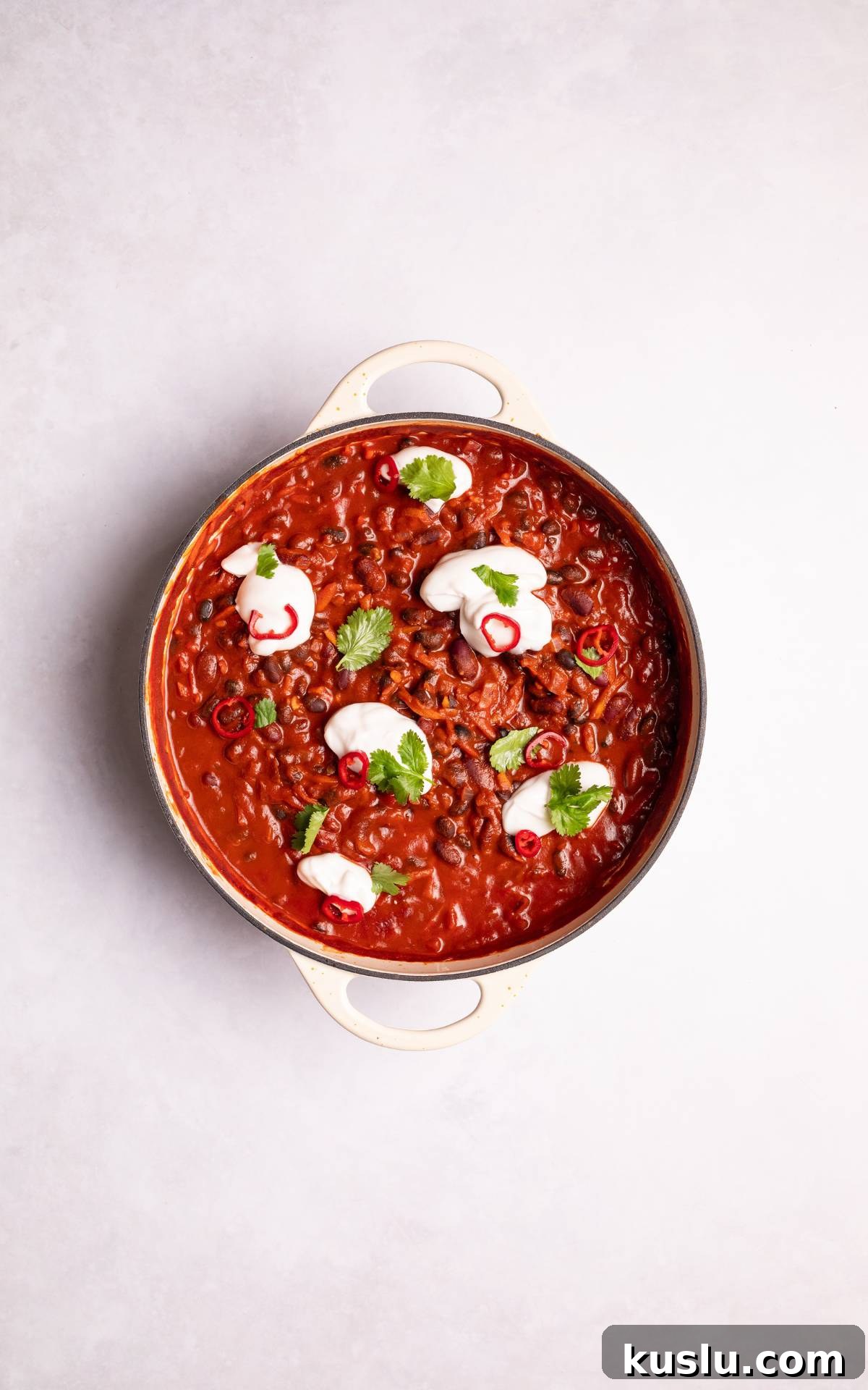 Vegan Chili in a dish topped with plain yoghurt.