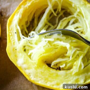 spaghetti squash in a ring with fork.