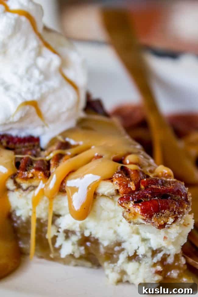Pecan Pie Cheesecake Recipe – Creamy Layered Pecan Dessert 4 cheesecake pecan pie with caramel sauce and whipped cream.
