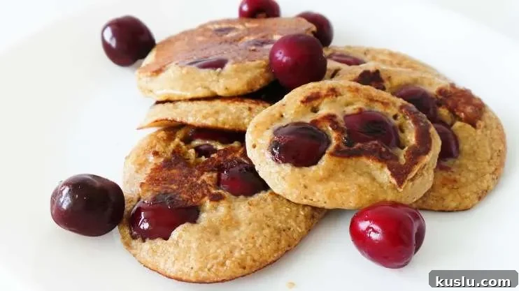 Healthy cherry pancakes! Made with oats, yogurt and honey these are an easy healthy breakfast that you can eat on the go! Ready in 10 minutes, also great for toddlers and kids!
