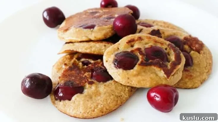 Healthy cherry pancakes! Made with oats, yogurt and honey these are an easy healthy breakfast that you can eat on the go! Ready in 10 minutes, also great for toddlers and kids!