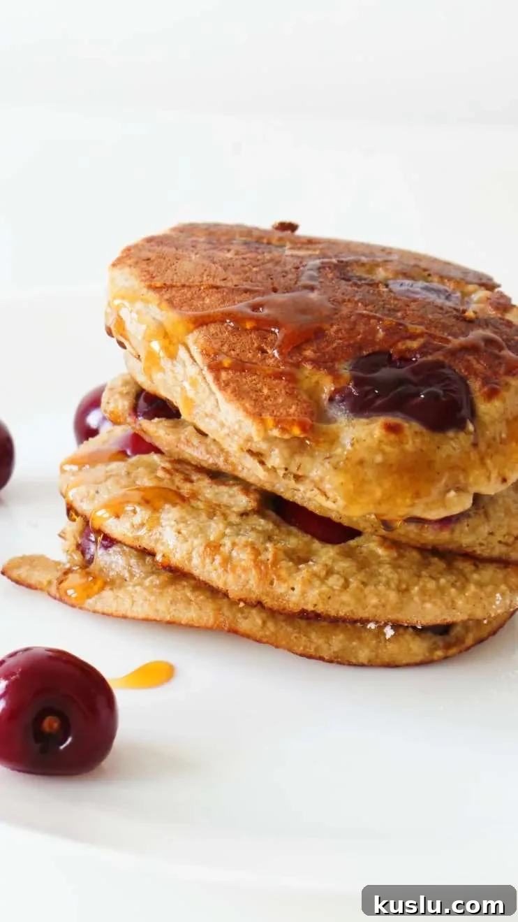 Healthy cherry pancakes! Made with oats, yogurt and honey these are an easy healthy breakfast that you can eat on the go! Ready in 10 minutes, also great for toddlers and kids!