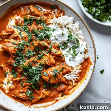 Creamy coconut chicken curry with chopped coriander and rice.