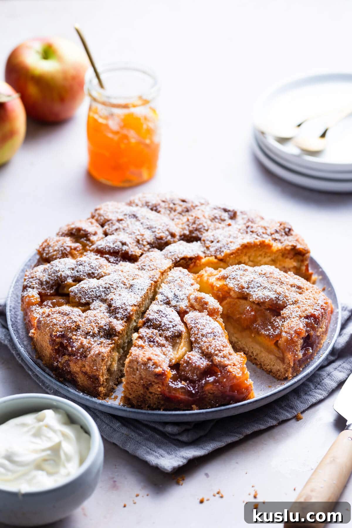 45 degree angle view of an apple cake on a round plate