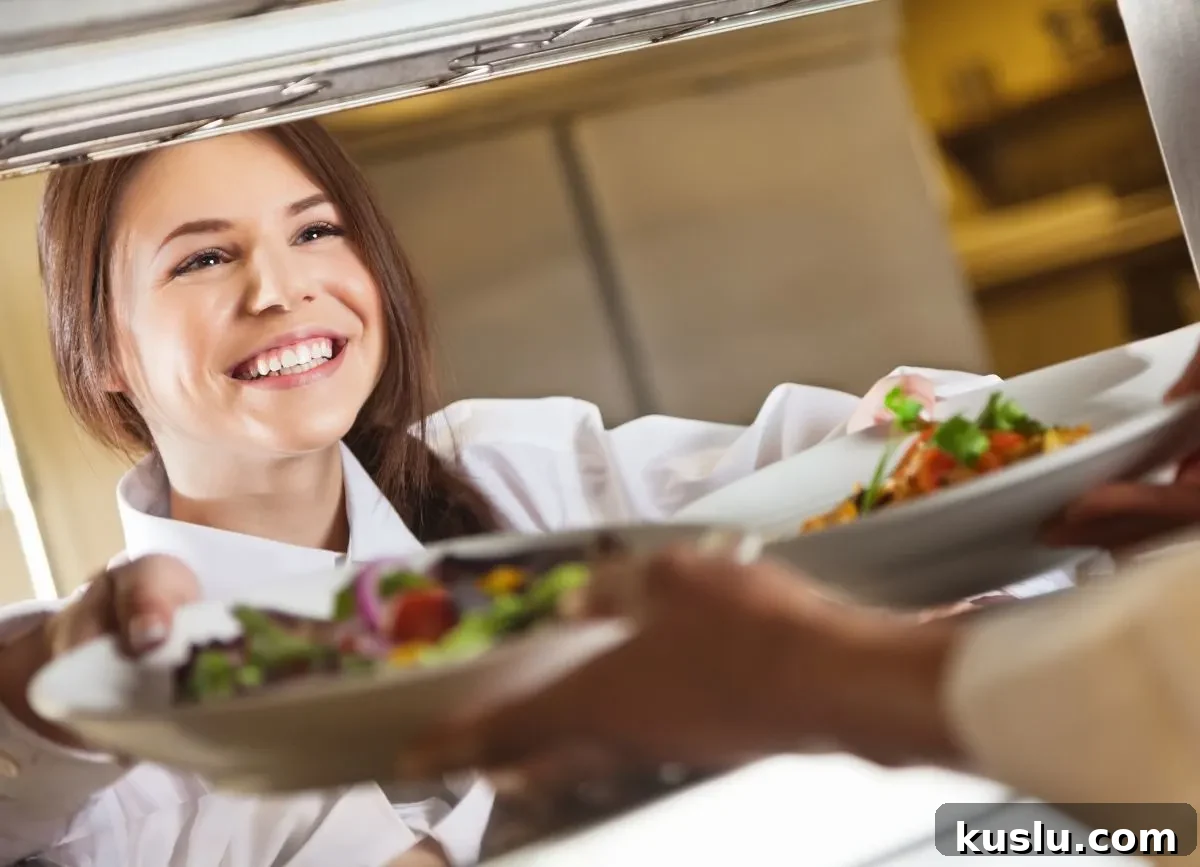 Gluten-Free & Dairy-Free Menu Options at The Cheesecake Factory 4 Chef passing salad plates to server.
