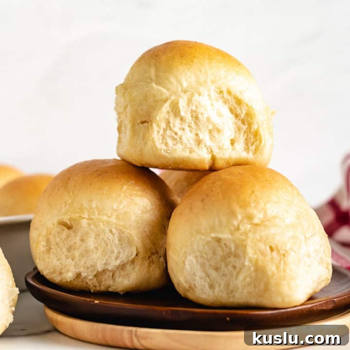 Creamy Lobster Mashed Potatoes Recipe for Dinner Guests 4 Pile of dinner rolls on a plate.