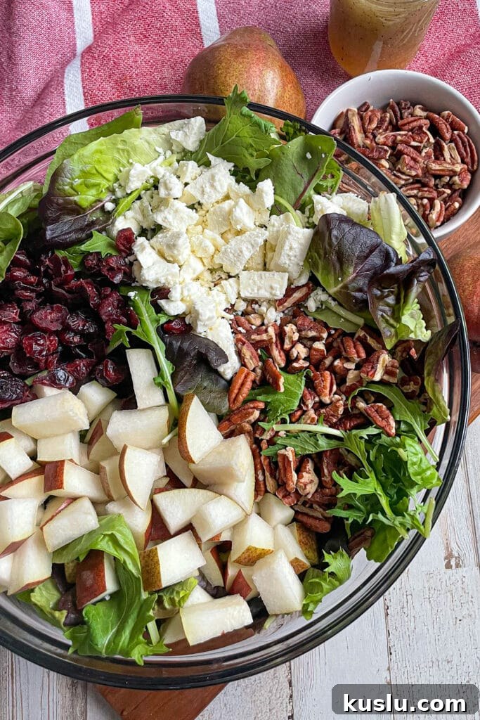 Ingredients for autumn pear salad served in a large mixing bowl