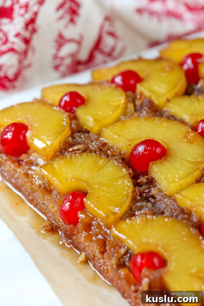 Classic Pineapple Upside-Down Cake Recipe with Caramelized Pineapple 10 freshly baked pineapple upside down cake with bright red cherries