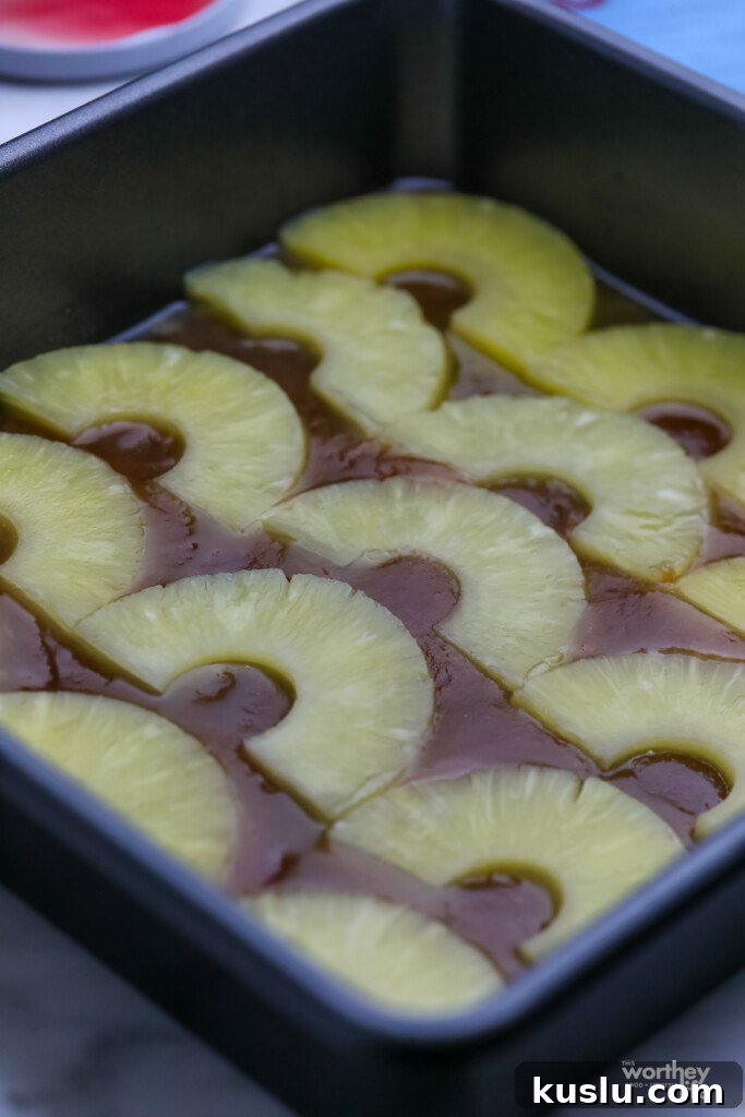 Classic Pineapple Upside-Down Cake Recipe with Caramelized Pineapple 6 pineapple halves in cake pan