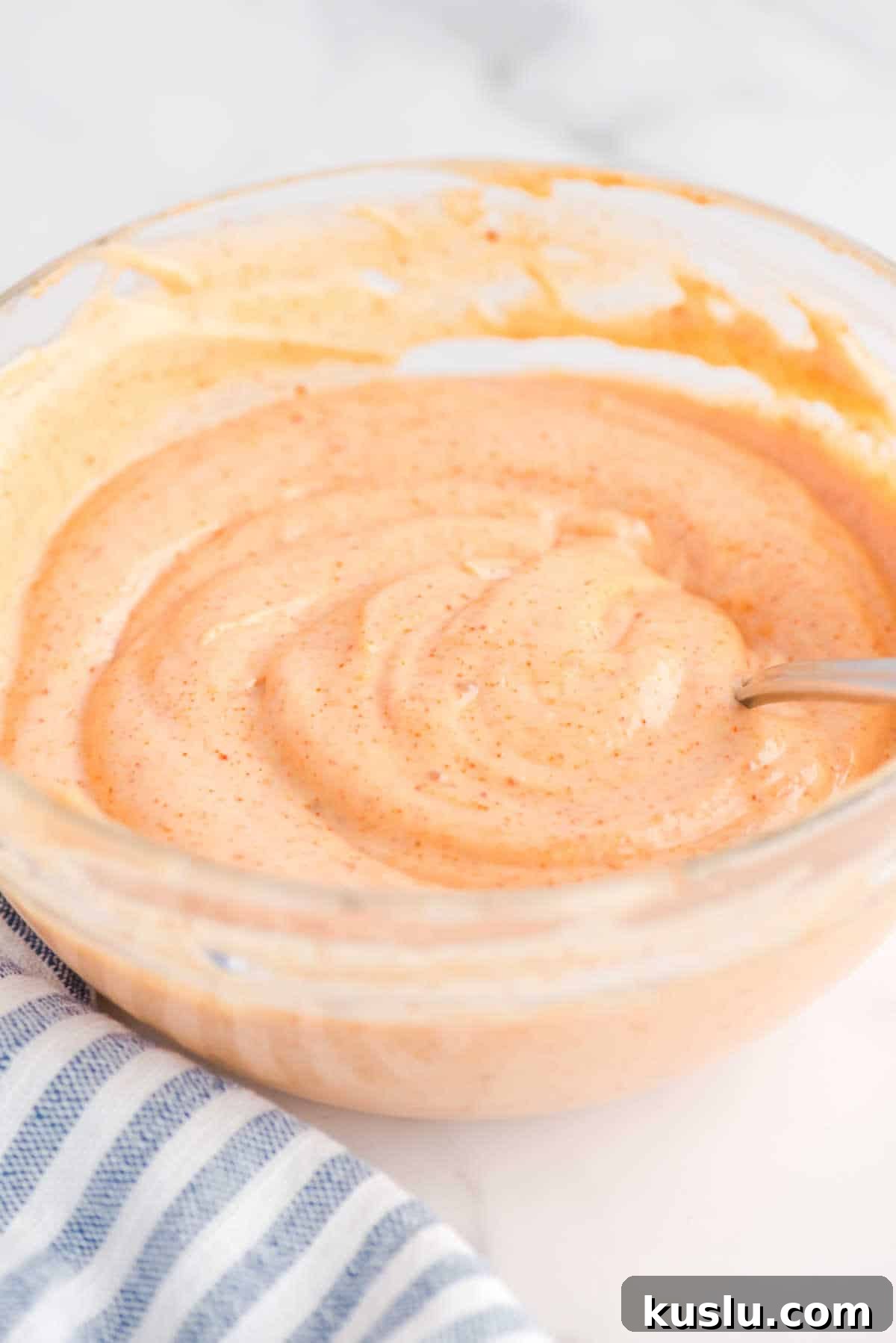 How to Make Yum Yum Sauce at Home: Simple Japanese Steakhouse Recipe 2 Yum Yum Sauce in a bowl with a spoon.