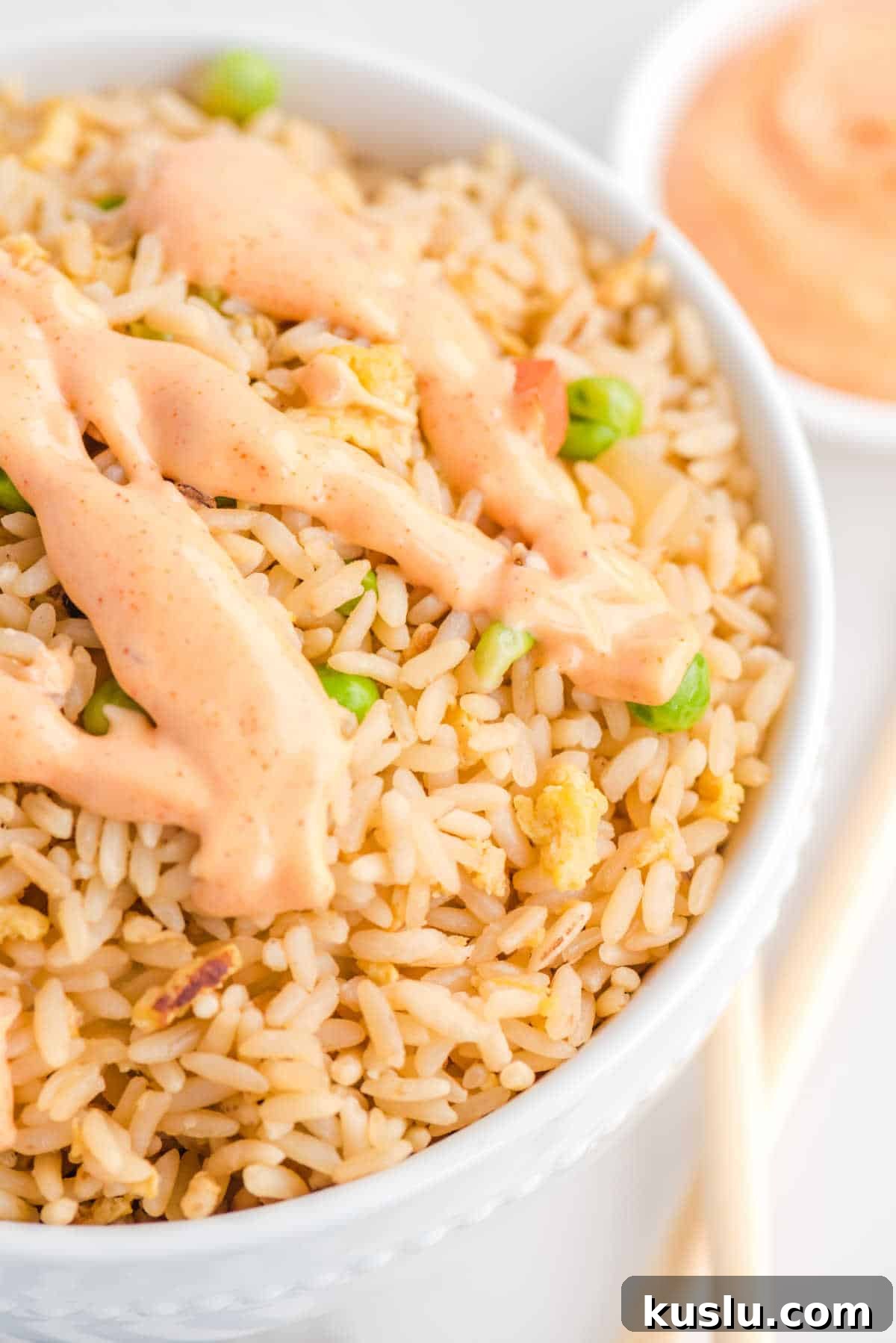 How to Make Yum Yum Sauce at Home: Simple Japanese Steakhouse Recipe 7 Yum yum sauce on a bowl of rice.