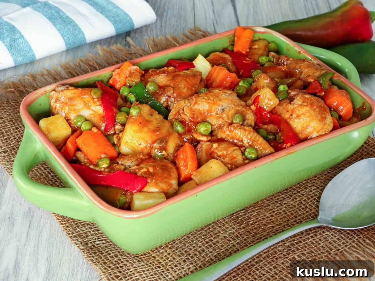 afritadang manok with pinya in a serving dish