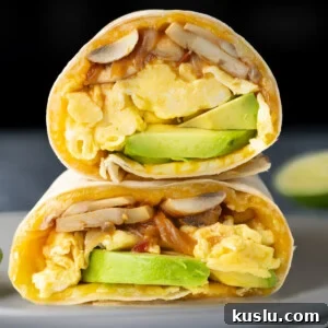 Vegetarian Breakfast Burrito with Fresh Salsa Recipe 11 Vegetarian breakfast burrito with mushrooms and onions cooked in salsa, eggs, cheese, and avocado.