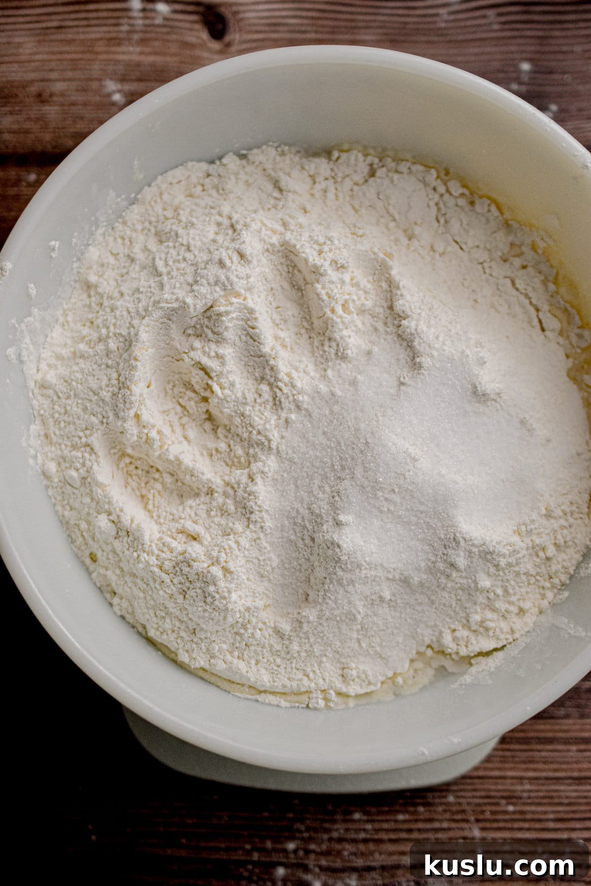 Sourdough Cast-Iron Pizza Without Yeast: Crispy Homemade Pie 5 The flour and salt are added to the bowl.