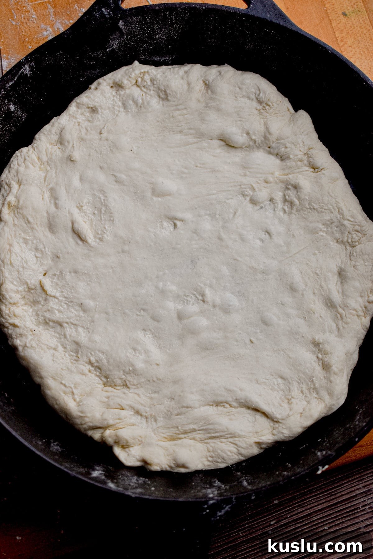 Sourdough Cast-Iron Pizza Without Yeast: Crispy Homemade Pie 9 One of the pizzas has been par-baked in a cast iron skillet.