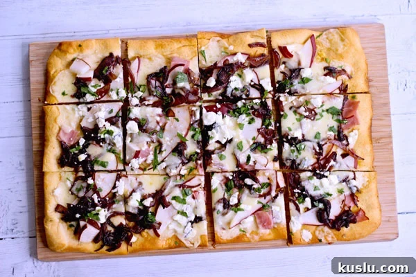 Pear and goat cheese flatbread with caramelized onions and ham