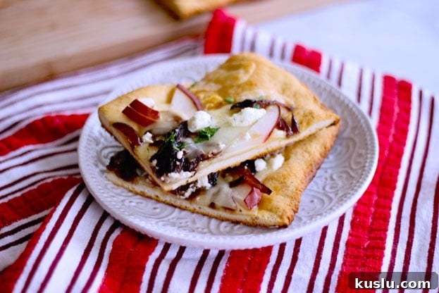 pear and goat cheese flatbread topped with caramelized onions, ham and cheddar