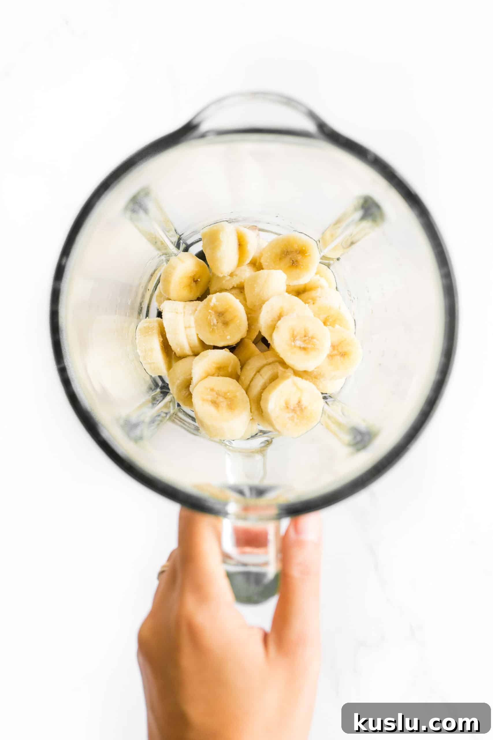 Frozen bananas to be blended in an electric blender.