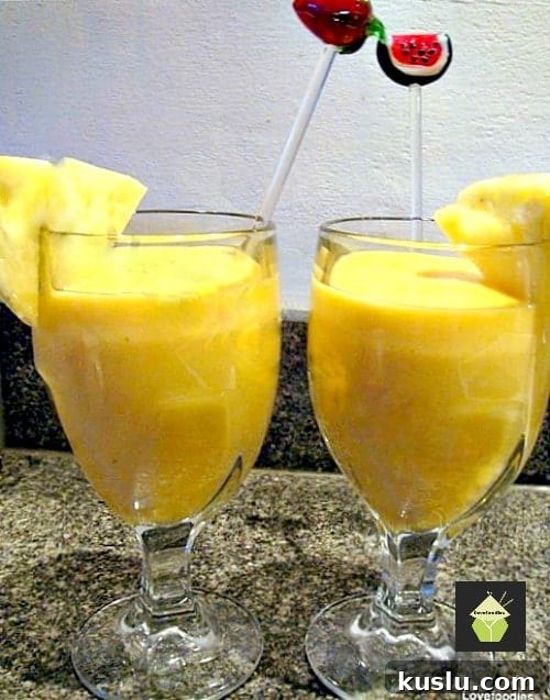 Tropical Creamy Smoothie. A lovely cool, refreshing drink perfect to start your morning off happy! | Lovefoodies.com Tropical Creamy Smoothie. A lovely cool, refreshing drink perfect to start your morning off happy! | Lovefoodies.com