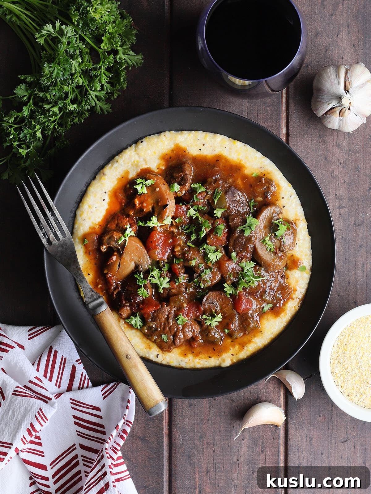 Southern Grillades and Grits Recipe: Classic New Orleans Comfort Food 2 Bowl of grillades and grits garnished with chopped fresh parsley.