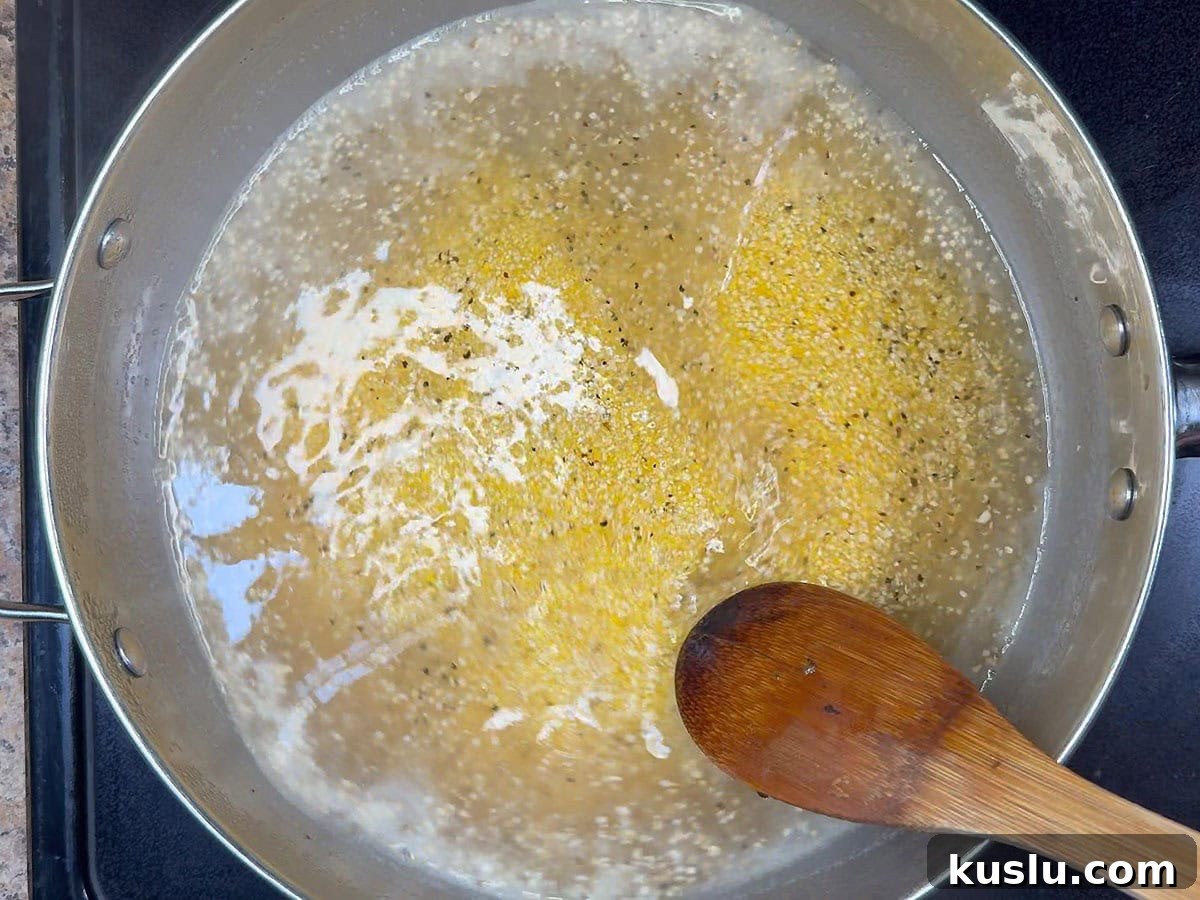 Southern Grillades and Grits Recipe: Classic New Orleans Comfort Food 12 Stirring corn grits into simmering liquid